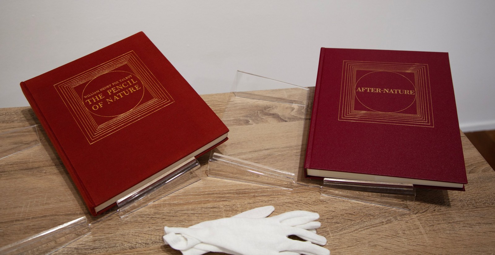The Pencil of Nature (1969 facsimile) and After-Nature shown side by side on book cradles, with archival gloves